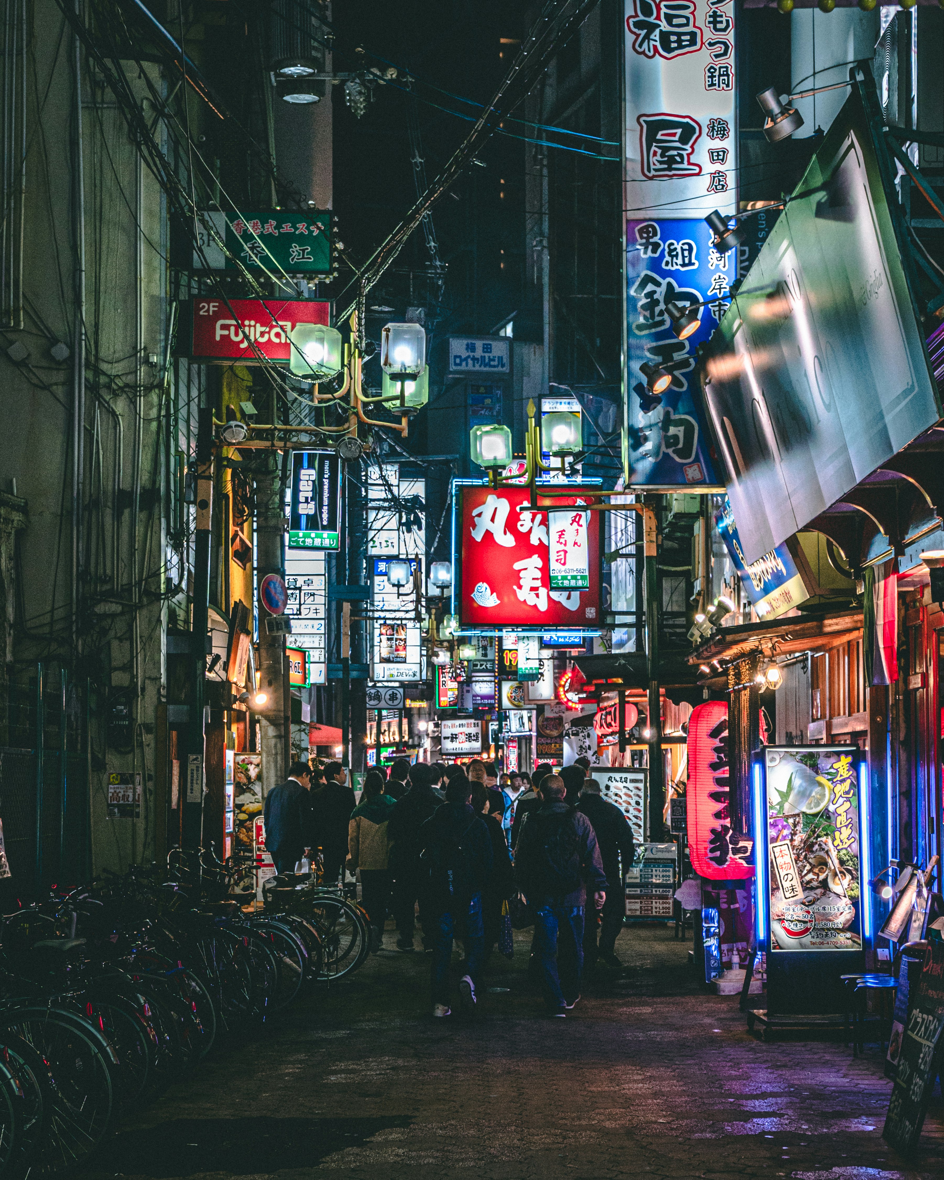 people walking on street during nighttime